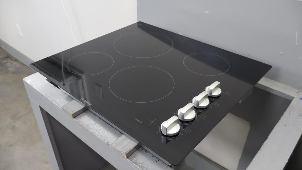 Bosch 24" 500 Series Infinite Temp Control Blk Glass Electric Cooktop NEM5466UC - Alabama Appliance