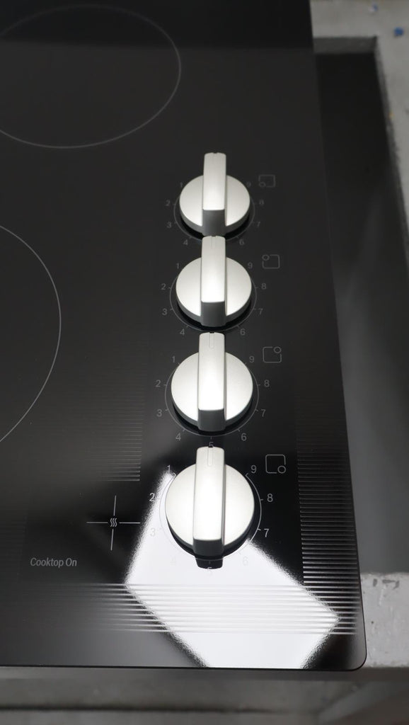 Bosch 24" 500 Series Infinite Temp Control Blk Glass Electric Cooktop NEM5466UC - Alabama Appliance